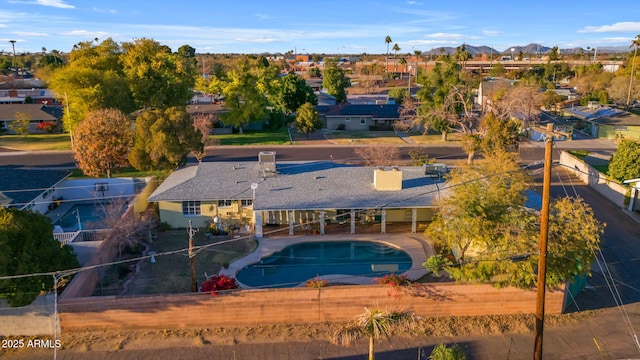 drone / aerial view featuring a residential view and a mountain view