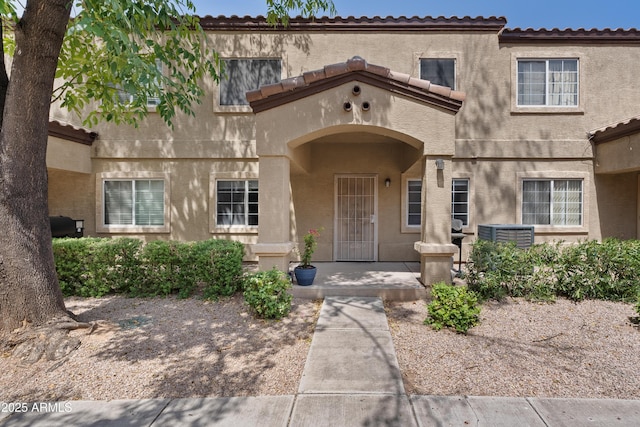 125 S 56th St Unit 27, Mesa, AZ 85206 - doorway to property featuring stucco siding and a tiled roof