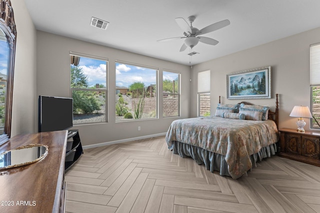 bedroom with light parquet flooring and ceiling fan