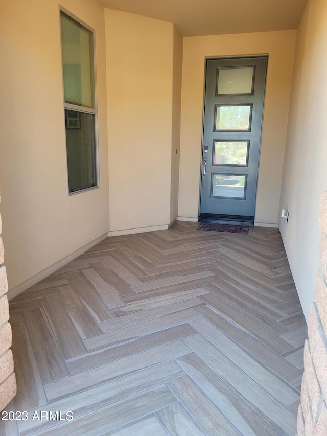 exterior space with light parquet flooring