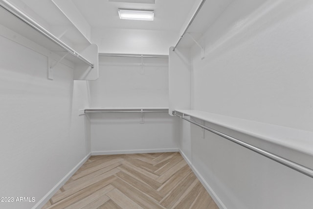 walk in closet featuring light parquet floors