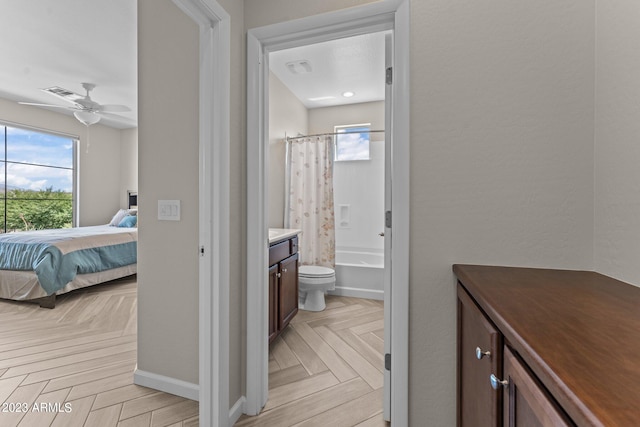 full bathroom with vanity, ceiling fan, toilet, shower / tub combo, and parquet floors