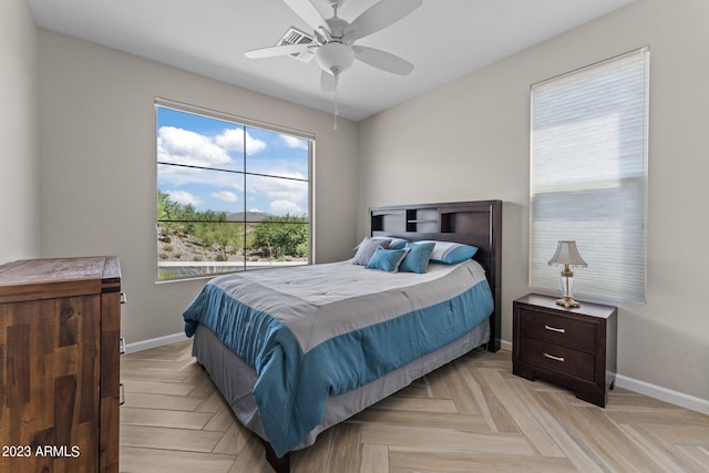 bedroom featuring light parquet flooring and ceiling fan