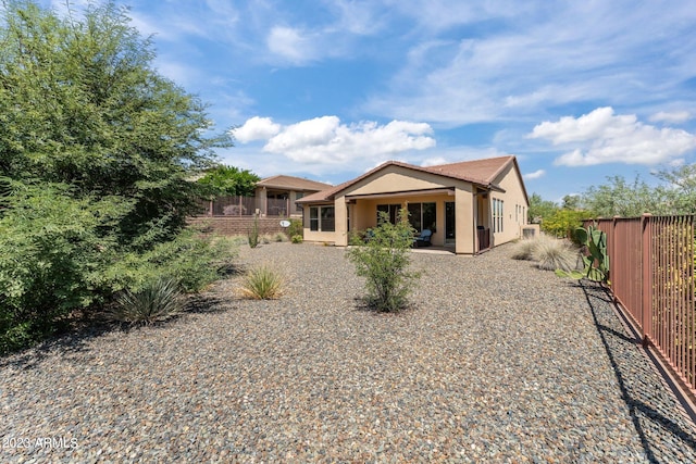 rear view of property with a patio