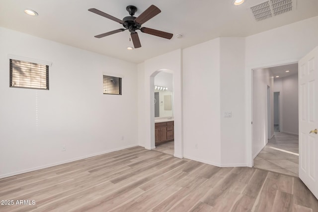 unfurnished room with ceiling fan and light hardwood / wood-style flooring