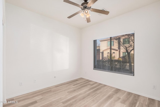 unfurnished room with light hardwood / wood-style floors and ceiling fan