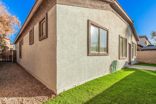 view of property exterior featuring a yard