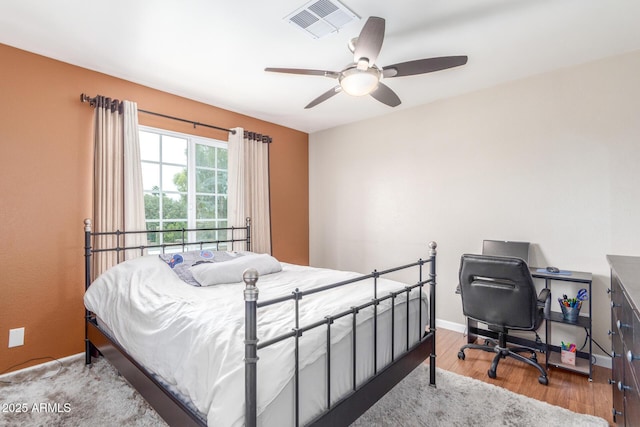 2508 N Karen Dr, Chandler, AZ 85224 - bedroom with wood finished floors, a desk, ceiling fan, and baseboards