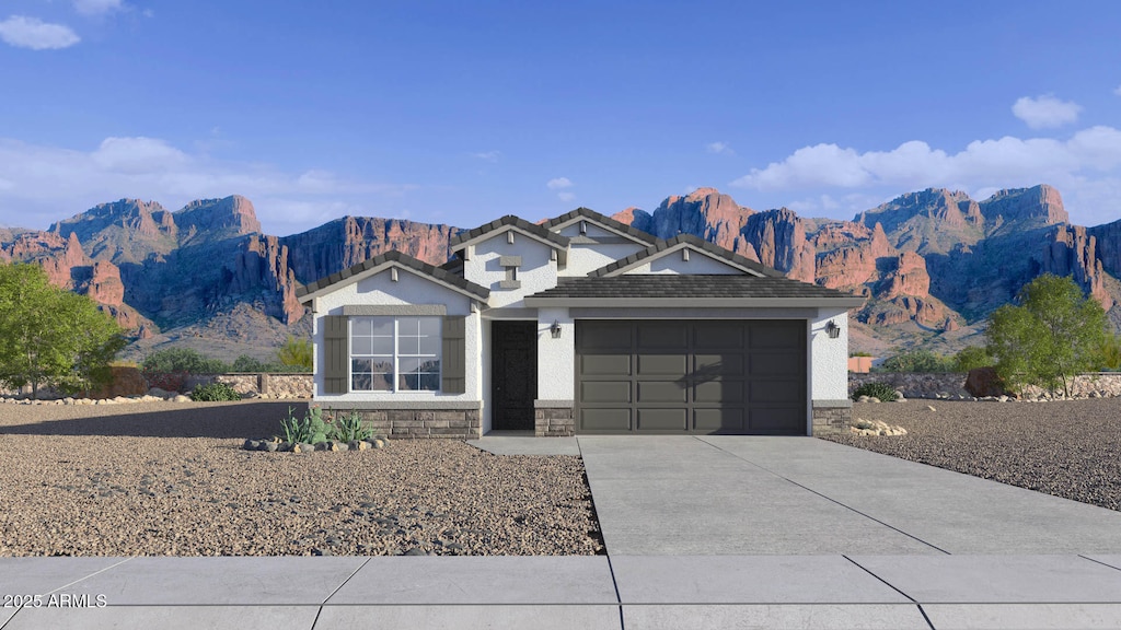 24254 W Hacienda Ave, Buckeye, AZ 85326 - view of front of house with stone siding, driveway, an attached garage, a mountain view, and stucco siding