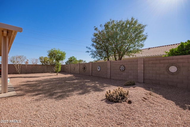 view of yard with a fenced backyard