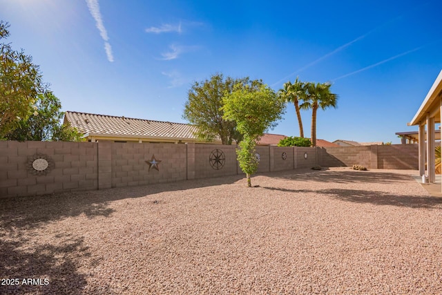 view of yard with a fenced backyard