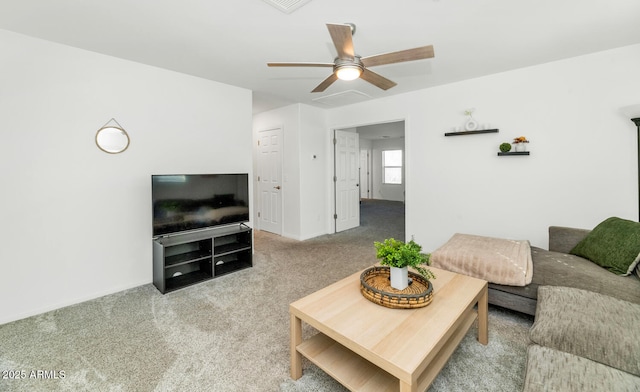 living area with ceiling fan and light colored carpet