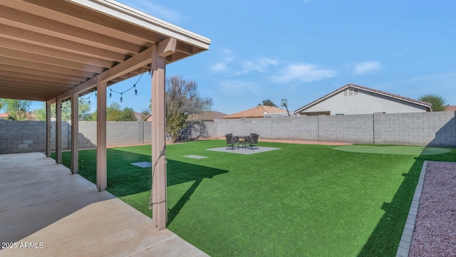 view of yard with a patio area and a fenced backyard