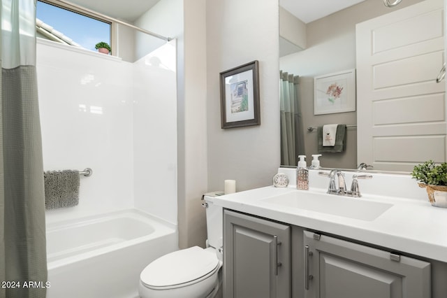 full bathroom with vanity, shower / tub combo with curtain, and toilet