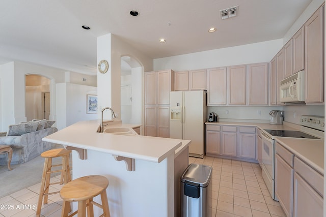 14806 E Lookout Ledge, Fountain Hills, AZ 85268 - kitchen with white appliances, a sink, arched walkways, light tile patterned floors, and open floor plan