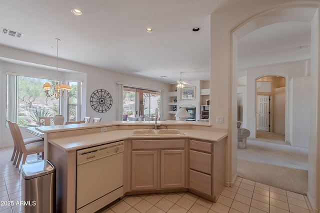 14806 E Lookout Ledge, Fountain Hills, AZ 85268 - kitchen featuring white dishwasher, a sink, arched walkways, light countertops, and light tile patterned floors