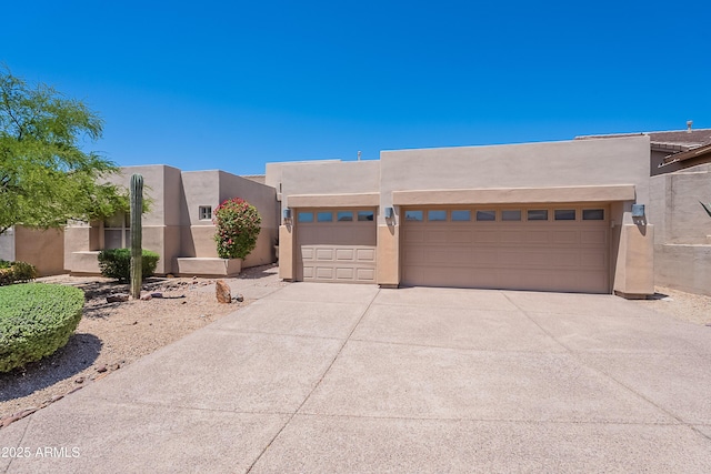 14806 E Lookout Ledge, Fountain Hills, AZ 85268 - southwest-style home featuring stucco siding, a garage, and concrete driveway