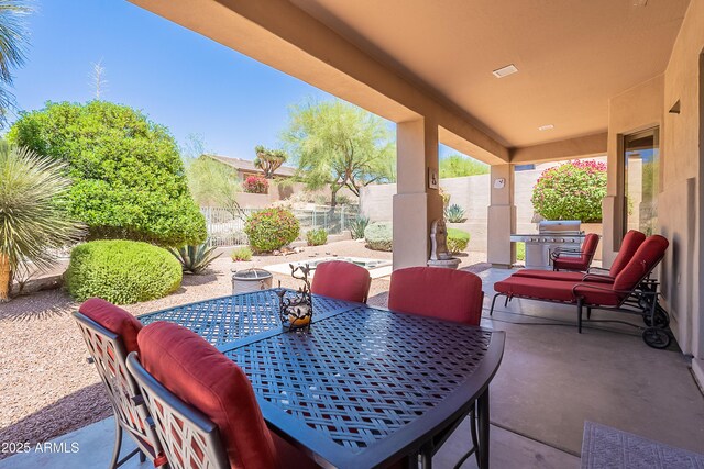 14806 E Lookout Ledge, Fountain Hills, AZ 85268 - view of patio / terrace with outdoor dining space, a fenced backyard, and grilling area