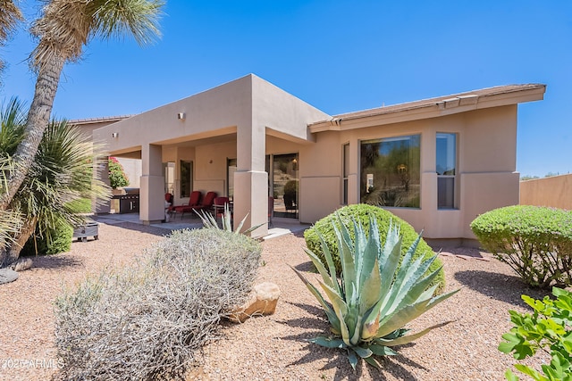 14806 E Lookout Ledge, Fountain Hills, AZ 85268 - rear view of house featuring stucco siding and a patio area