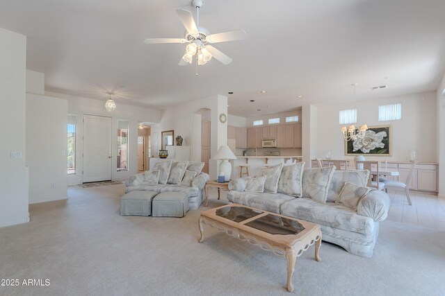 14806 E Lookout Ledge, Fountain Hills, AZ 85268 - living area with light colored carpet, ceiling fan, and a chandelier