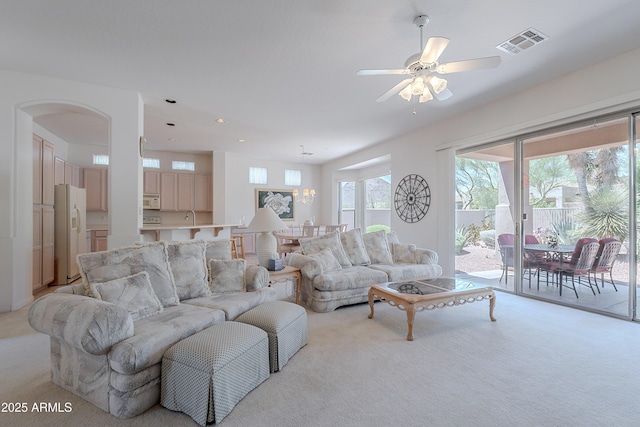 14806 E Lookout Ledge, Fountain Hills, AZ 85268 - living room with light colored carpet, arched walkways, ceiling fan, and recessed lighting