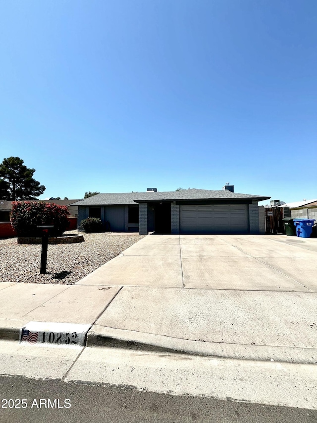 view of front of house with a garage and driveway