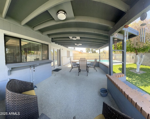 view of patio / terrace with a fenced backyard, a fenced in pool, and outdoor dining area
