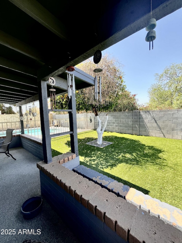 view of yard with a patio area, a fenced backyard, and a fenced in pool