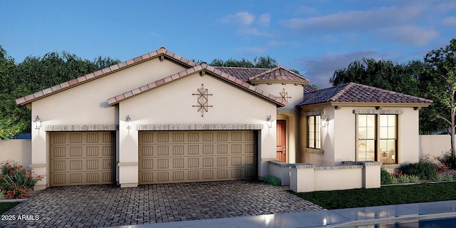 mediterranean / spanish house featuring a garage