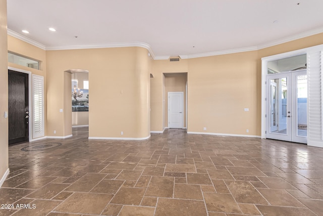 interior space with french doors and ornamental molding