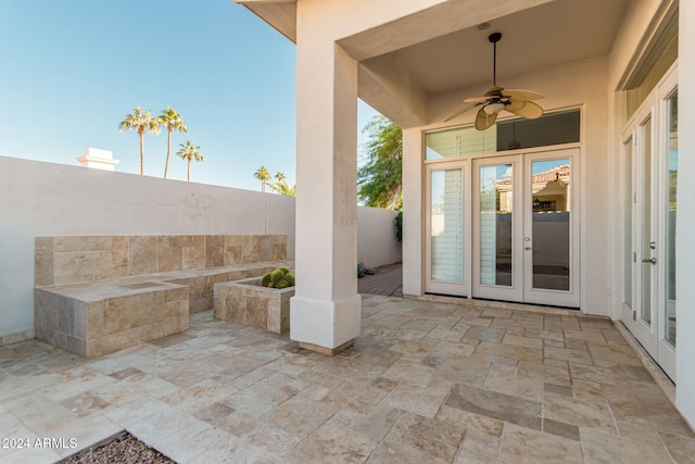 view of patio featuring ceiling fan and french doors