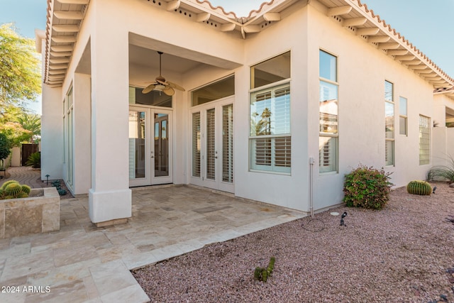 exterior space with french doors, ceiling fan, and a patio area