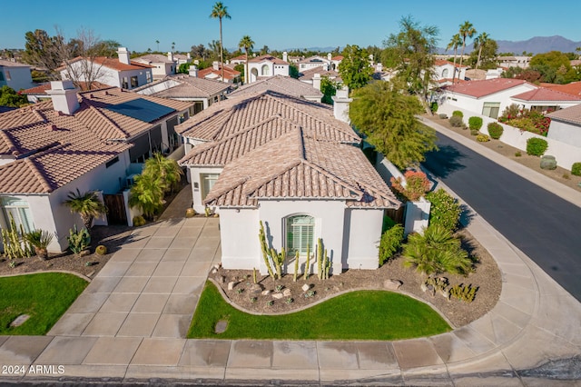 birds eye view of property with a mountain view