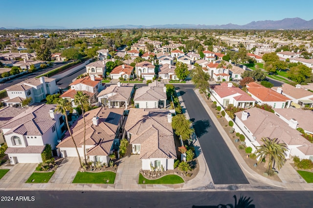 birds eye view of property with a mountain view