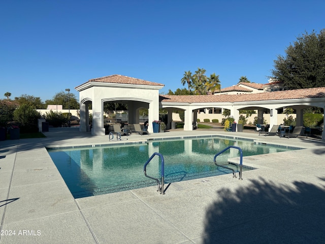 view of swimming pool featuring a patio