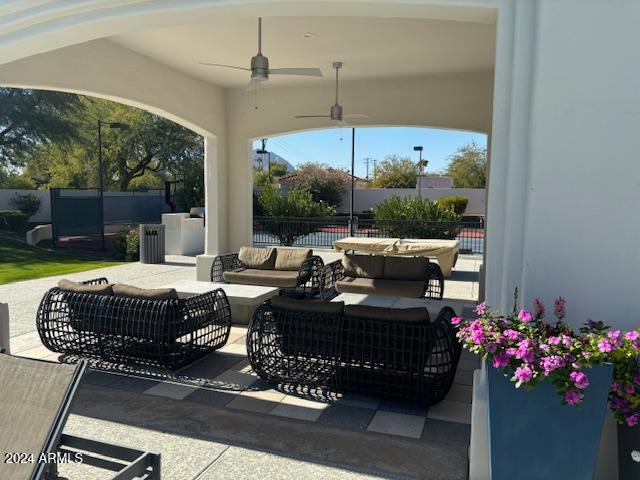 view of patio featuring an outdoor living space and ceiling fan