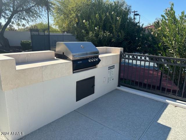 view of patio / terrace featuring area for grilling and exterior kitchen