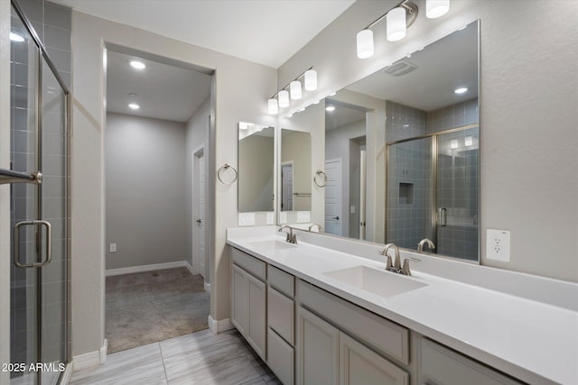 1823 E Chelsea Ln Unit 106, Gilbert, AZ 85295 - full bathroom with a stall shower, double vanity, and baseboards