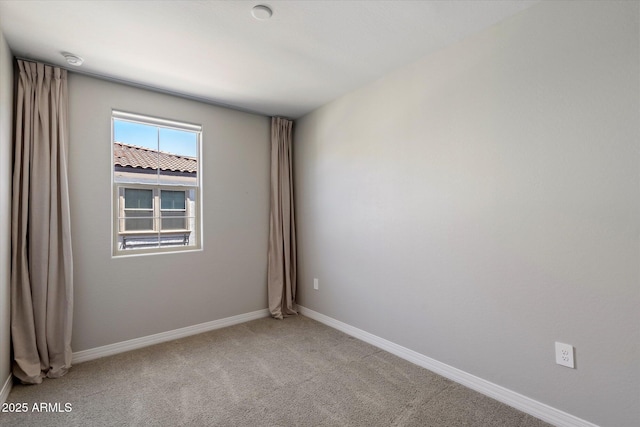 1823 E Chelsea Ln Unit 106, Gilbert, AZ 85295 - empty room featuring light colored carpet, baseboards, and a smoke detector