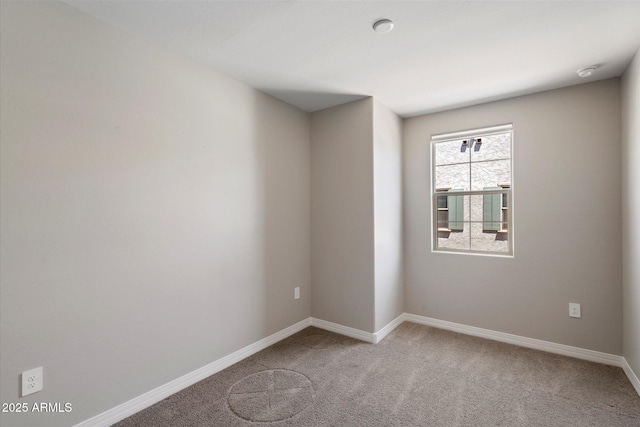 1823 E Chelsea Ln Unit 106, Gilbert, AZ 85295 - unfurnished room featuring light colored carpet, baseboards, and a smoke detector