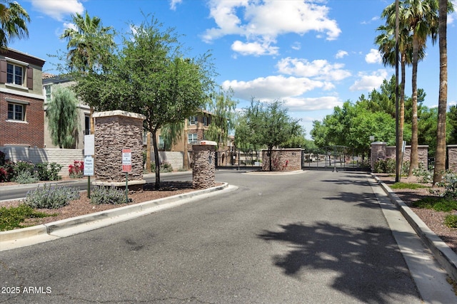 1823 E Chelsea Ln Unit 106, Gilbert, AZ 85295 - view of asphalt street featuring curbs, a gated entry, and a gate