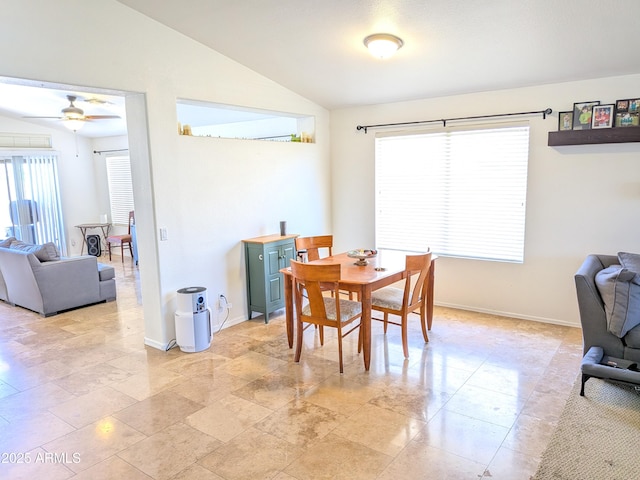11424 S Obispo Dr, Goodyear, AZ 85338 - dining area with vaulted ceiling, a ceiling fan, and baseboards