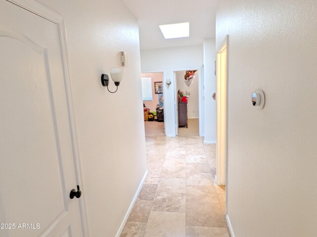 11424 S Obispo Dr, Goodyear, AZ 85338 - hall with baseboards and a skylight