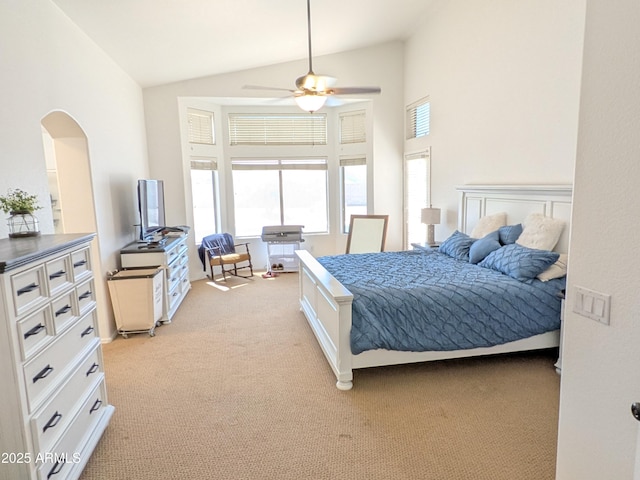 11424 S Obispo Dr, Goodyear, AZ 85338 - bedroom featuring vaulted ceiling, light carpet, arched walkways, and ceiling fan