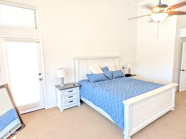11424 S Obispo Dr, Goodyear, AZ 85338 - bedroom with light carpet, multiple windows, and a ceiling fan