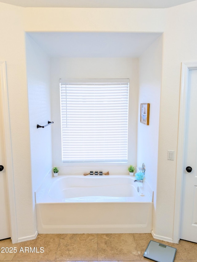 11424 S Obispo Dr, Goodyear, AZ 85338 - bathroom featuring a bath, tile patterned floors, and healthy amount of natural light