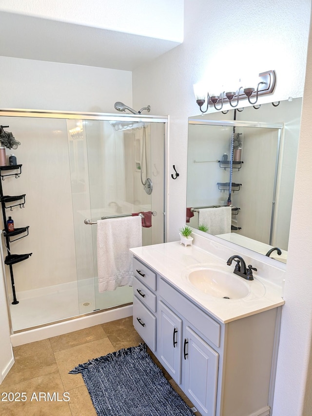 11424 S Obispo Dr, Goodyear, AZ 85338 - bathroom with a shower stall, vanity, and tile patterned floors