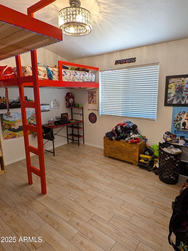 11424 S Obispo Dr, Goodyear, AZ 85338 - home office featuring wood finished floors, a chandelier, and baseboards