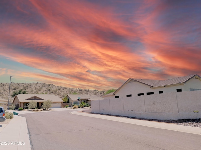 11424 S Obispo Dr, Goodyear, AZ 85338 - view of asphalt road with street lights