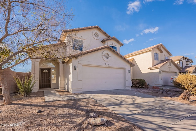 mediterranean / spanish-style house with a garage